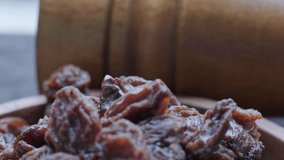 Close up footage of brown raisins. Selective focus. Tracking shots.