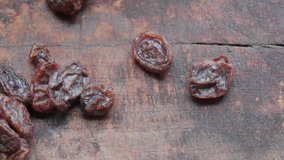 Close up footage of brown raisins. Selective focus. Panning to the left.