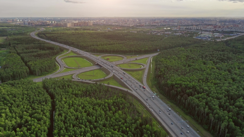 Aerial drone hyper lapse or time lapse video of popular highway of Attiki Odos multilevel junction road, passing through National motorway in traffic jam, Attica, Greece