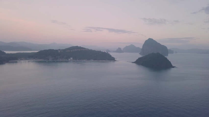 Red Sky Sunset over Las Cabanas Beach El Nido Palawan - Drone Shot