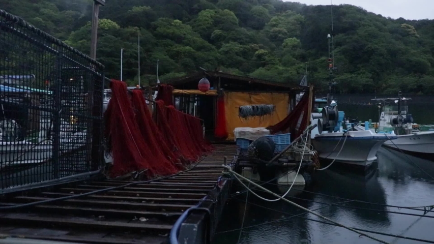 Man walks onto Oriental boatyard dock