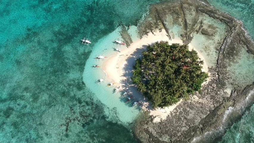 Top down aerial of the small and tropical Guyam Island, Siargao, Philippines