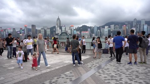 Hong Kong, China, June 02, 2019: Slow Motion of Tourists visiting the Avenue of the Stars which is one of the most visited tourist attractions in Hong Kong.