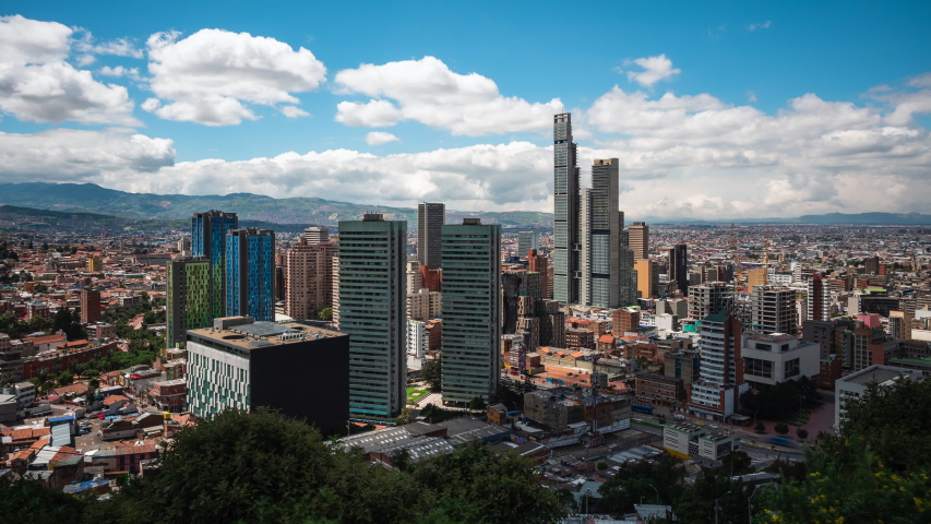 Bogota, Colombia, zoom in time lapse view of Bogota cityscape on a sunny day. Bogota is the sprawling capital of Colombia and one of the largest cities in South America.