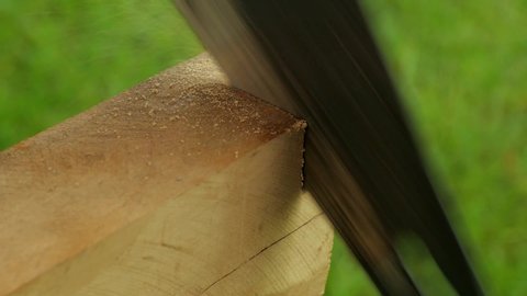 Hand saw on wood. Hacksaw. Sawing wood hacksaw. Close-up