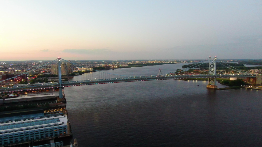 Evening flight over the Ben Franklin Bridge in Philadelphia