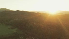 Solar Flare Sunrise over Tennessee Mountains Pasture Farm Drone Shot