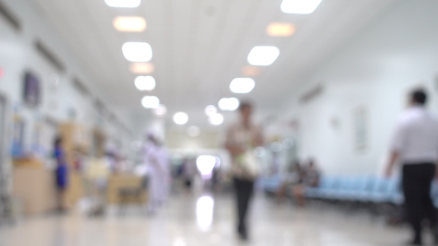 Blurred with Nurse Practices and patients waiting to see the doctor at the hospital examination room in the scene