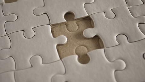 Piece of white jigsaw filling by hand, Success concept