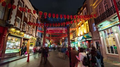 LONDON / UK - NOVEMBER 21, 2018: Time lapse zoom in view of Chinatown in London with at night with lights shifting color