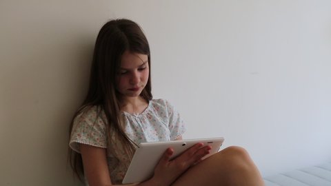 Beautiful teen girl and the tablet