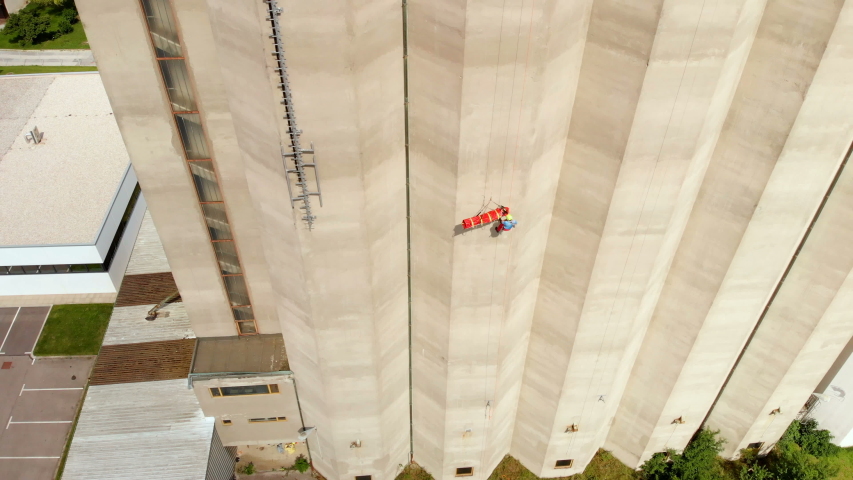 A firefighter helped to rescue someone who got injured when climbing to the top of a very high building.