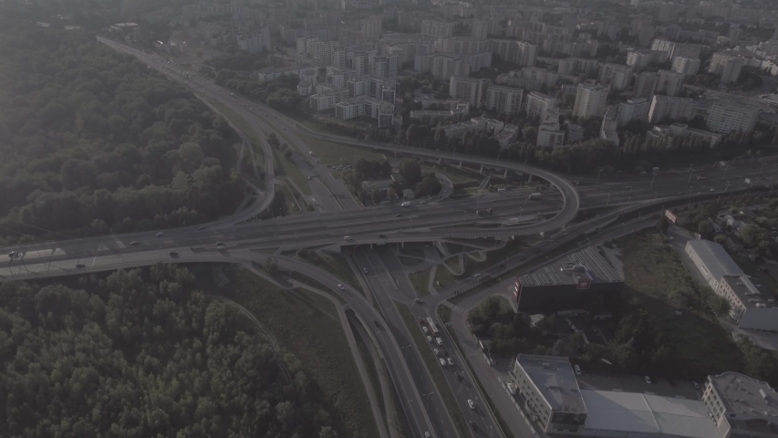 
Top view downward of the drone shows an impressive highway elevation and the convergence of roads, bridges, viaducts in Warsaw during the day, the development of transport and infrastruc. 4K. RAW  | Shutterstock HD Video #1030682318