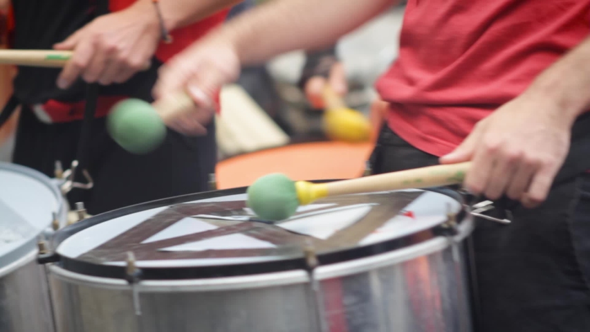 Brazilian batucada playing drums. Dress in red | Shutterstock HD Video #1030694456