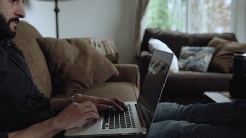 Portrait of a man working on his computer in his home. Shot on a Canon C200 in 4K in San Francisco in 2019.