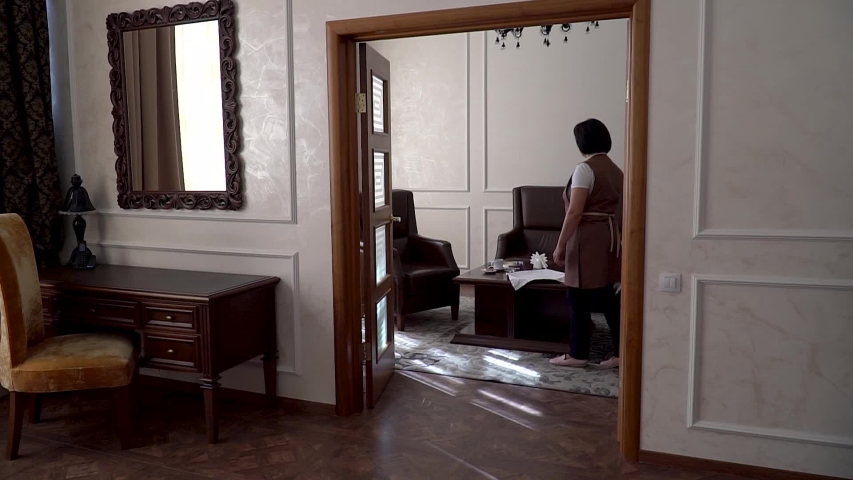 The maid cleans the hotel rooms