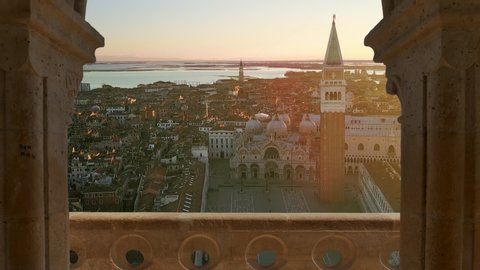 aerial view of venice st mark square drone coming out from an old balcony italy