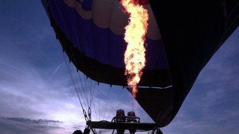 Close up slow motion video of propane gas fire burner in hot air balloon for take off
