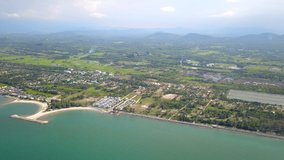 4K video resolution,Top view from Drone flight over sea beach and countryside at Southern Thailand