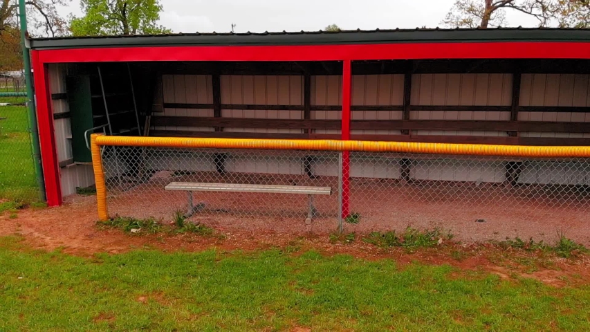 Bright red and yellow dugout on the little leauge baseball field