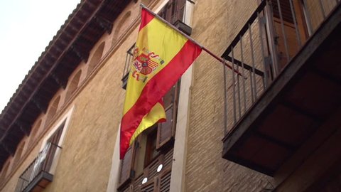 Spanish national flag against a building