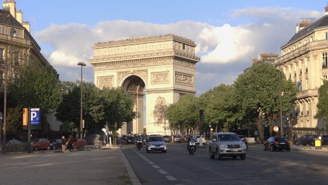 Paris, France - June 2019 : Wide shot of Arc de Triomphe in Paris France, view of the arch standing at the end of Champs-Elysees Avenue at the center of Place Charles de Gaulle Square