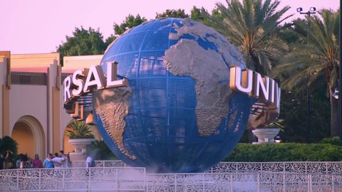 Orlando, Florida. May 22, 2019. Universal Studios world sphere at Citywalk and palm trees in Universal Studios area.