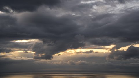 Timelapse of Epic Storm Clouds Over the Ocean at Sunset