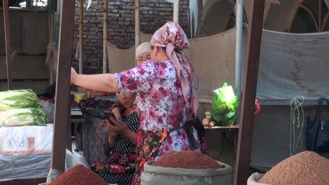osh, Kyrgyzstan - 06 24 2018: june 24, 2018: Osh Bazar A Vendors at Osh Bazar. Dry Fruits and Spices