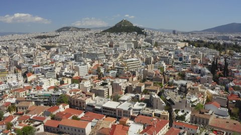 Aerial view of Mount Lycabettus and Parliament Building in Athens, Greece. Drone shot / bird's eye.