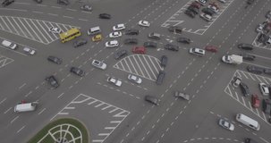 Top view. Kiev city intersection with cars on Victory Square. Aerial view of the road intersection, traffic at rush hour with cars on the road. Filmed from 4K drone in RAW. Video for post-processing.