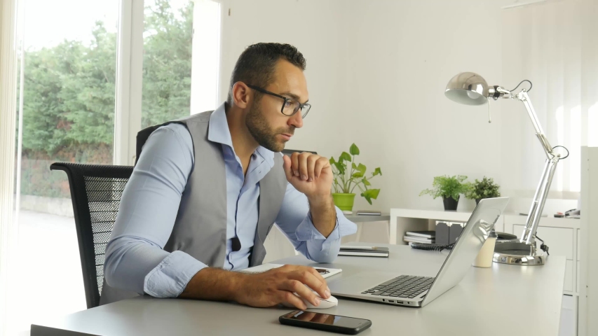 Portrait of handsome trendy casual mid age business man in office desk with laptop computer
 | Shutterstock HD Video #1030794566