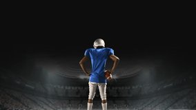 Digital composite of an African-american football player standing on a foggy field stadium - Powered by Shutterstock - Get 15% off with code: PIKWIZARD15