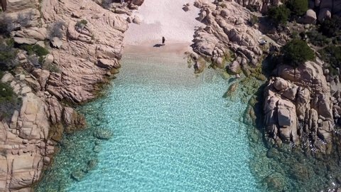 woman walks in the famous beach of Cala Coticcio, Costa Smeralda, Sardinia 스톡 비디오