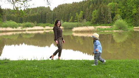 Mom Walks Her Little Son Stock Footage Video (100% Royalty-free
