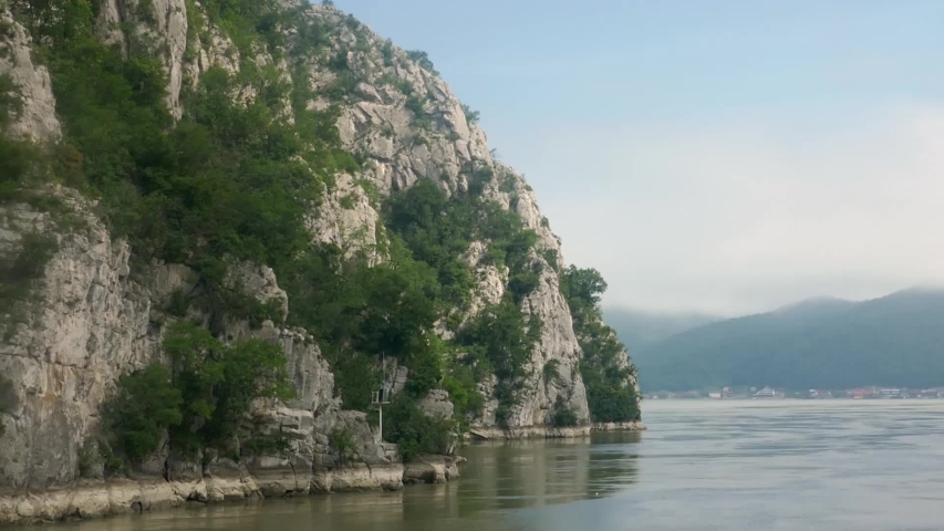 Cruising along Romanian coastline of Danube River through the Iron Gate.