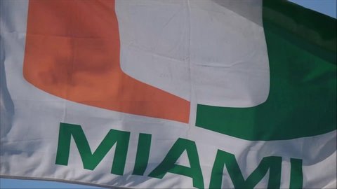 Cary, North Carolina / United States - 11 11 2018: University of Miami flag waving in wind in slow motion