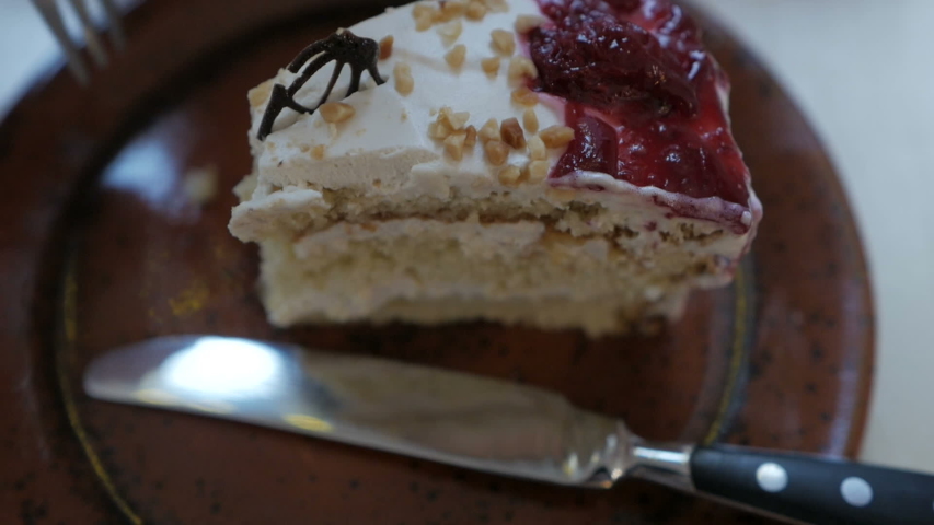 Girl has a cake and drinks coffee. Breakfast concept.