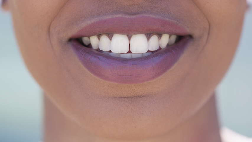 Close up of young black female mouth talking to camera | Shutterstock HD Video #1030837361