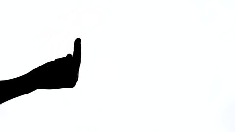 Hand sign showing middle finger in rude, isolated, black and white contrast shot. Human hand sign showing middle finger, negative expression