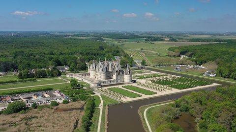 Aerial view of Chambord Castle (Chateau Chambord), picturesque castle in Loire Valley built in French Renaissance style, UNESCO world heritage site - landscape panorama of France from above, Europe