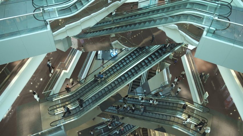 HONG KONG, CHINA - CIRCA MAY, 2019: Many Escalators in modern shopping mall. Very busy full of clients mall complex. Consumption concept time lapse | Shutterstock HD Video #1030867934