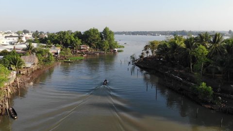 Drone follow boat on Mekong river, aerial shot, Cinematic Dolly In, Asia, Vietnam, Can tho,