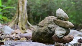 the Video of Close-up of stack of stones in perfect balance accomplish work is successful Stacked stones , Rock balancing or stone balancing (stone or rock stacking) Stacked stones Near the river