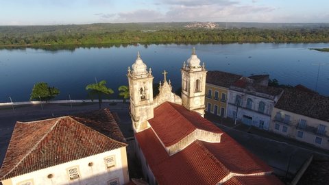 Penedo, Alagoas / Brazil - 05/30/2019: Aerial view of Nossa Senhora das Correntes Church in the historic center of the city and São Francisco River