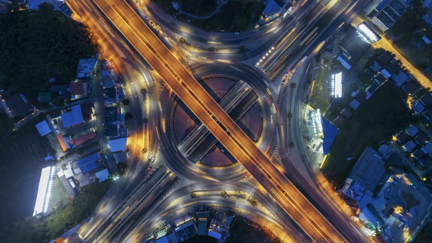 Hyperlapse timelapse of night city traffic on 4-way stop street intersection circle roundabout in bangkok at night, thailand. 4K UHD horizontal aerial view. | Shutterstock HD Video #1030883564