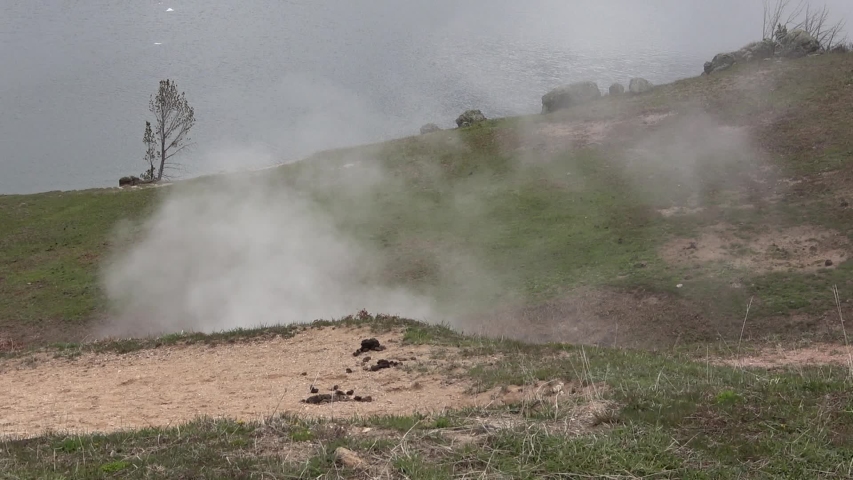 Steam rising from geysers in Yellowstone National Park