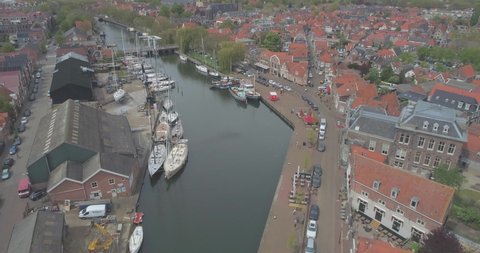Aerial towards sailing boats moored in the historic Dutch town Enkhuizen in North Holland the Netherlands