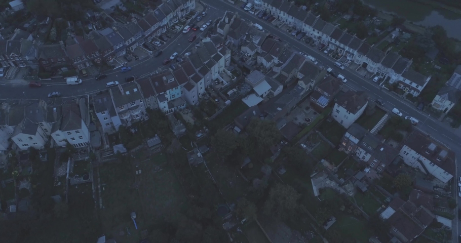 Night aerial over rows of residential houses in Hastings, England, United Kingdom Royalty-Free Stock Footage #1030886516