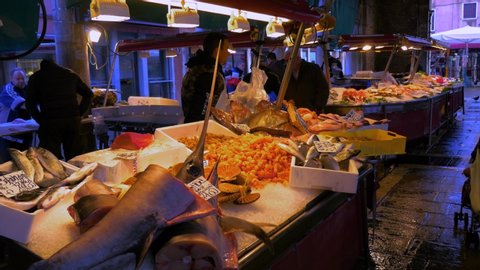 Venice, Italy - 11 01 2018: Detail of people at a fish fair in Venice. Italy. Flat plane.